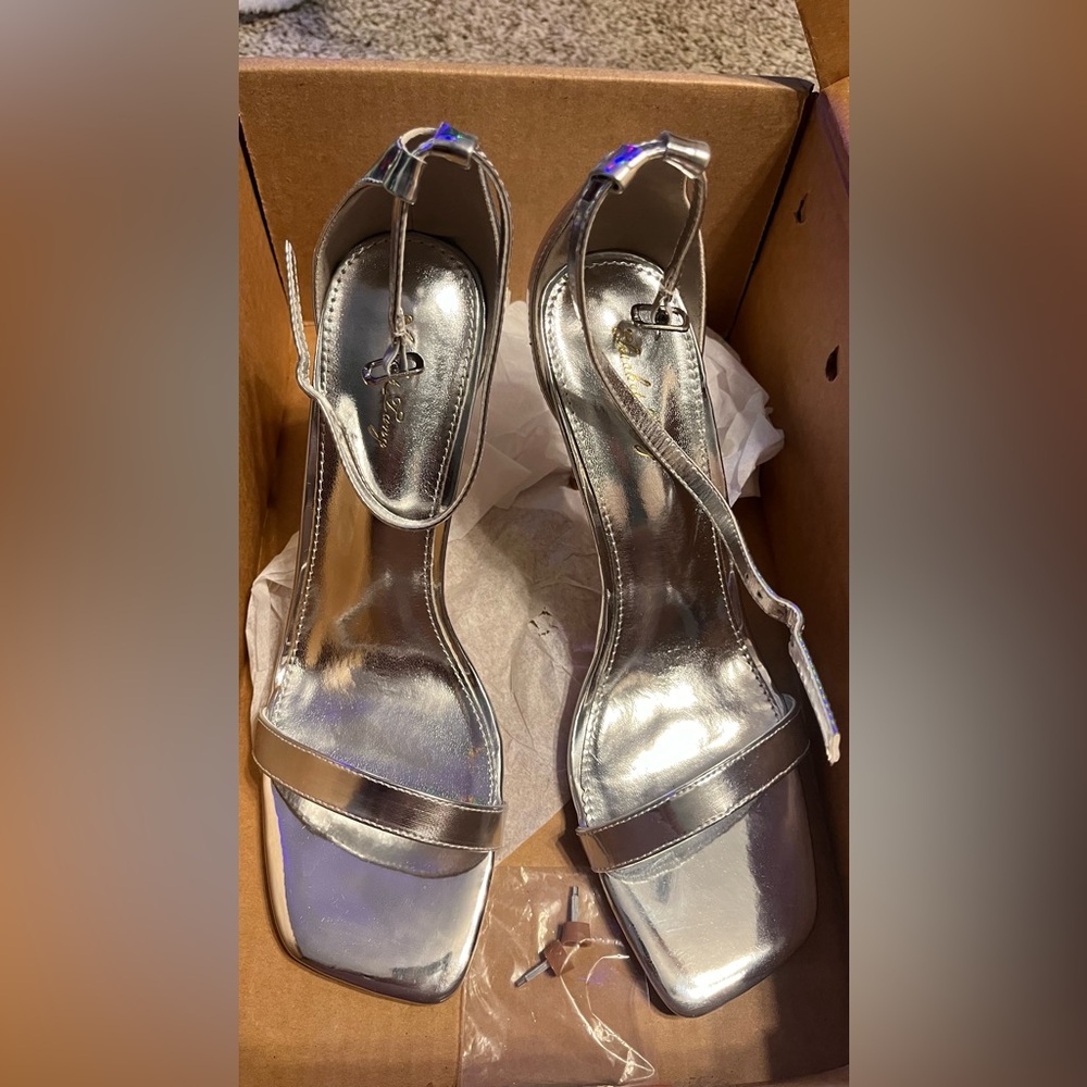 Brand new in box silver heels